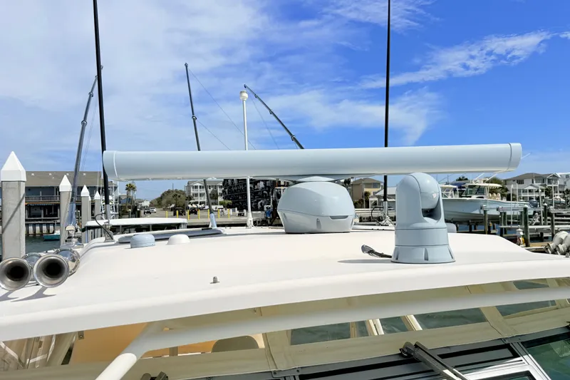 Slide: The Image of 2015 Grady-White Express 370 boat with radar equipment at a marina dock. - 38