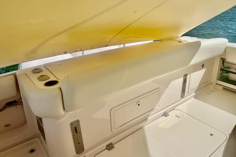 Slide: The Image of 2015 Grady-White Express 370 boat interior with cushioned seating and storage compartments. - 5