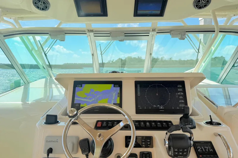 Slide: The Image of Helm of 2015 Grady-White Express 370 with advanced navigation displays and controls. - 8