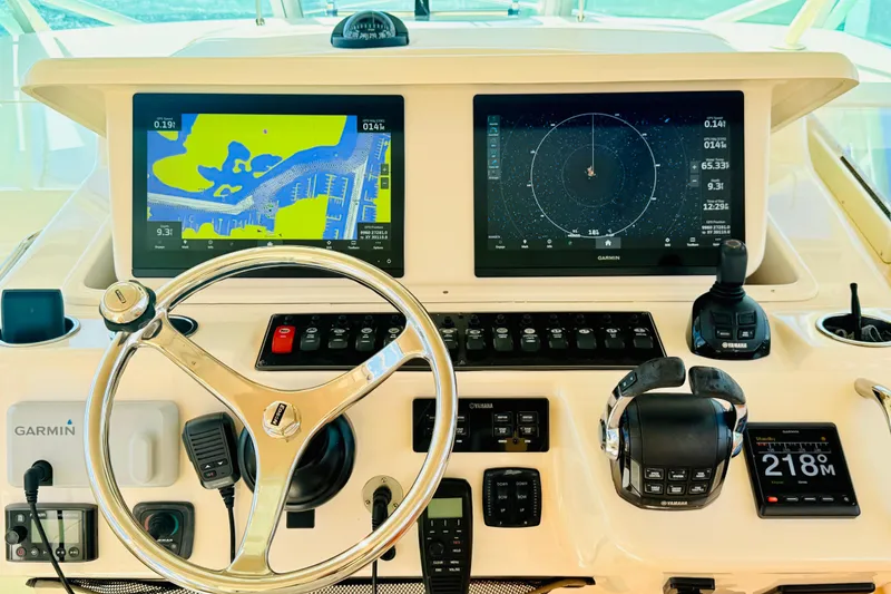 Slide: The Image of Control panel of 2015 Grady-White Express 370 boat with Garmin navigation displays. - 9