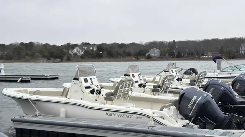 Slide: The Image of 2024 Key West 239 FS boats docked with Yamaha engines. - 2