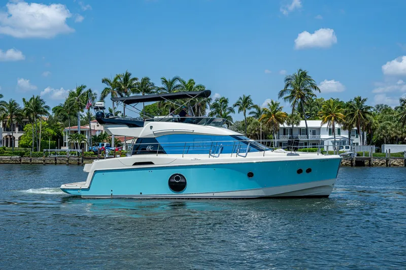 The Image of 2015 Beneteau Monte Carlo yacht cruising on a sunny day with palm trees in the background. - 0