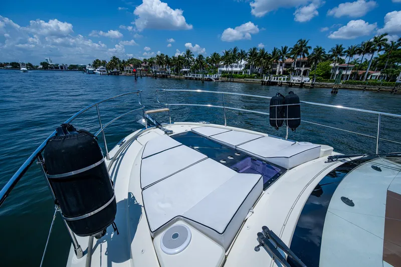 Slide: The Image of 2015 Beneteau Monte Carlo yacht with sunbathing deck, cruising on a scenic waterway. - 14