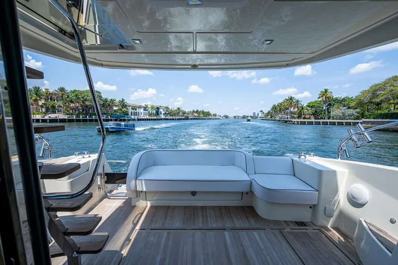 Slide: The Image of 2015 Beneteau Monte Carlo yacht with spacious deck, cruising on a scenic waterway. - 15