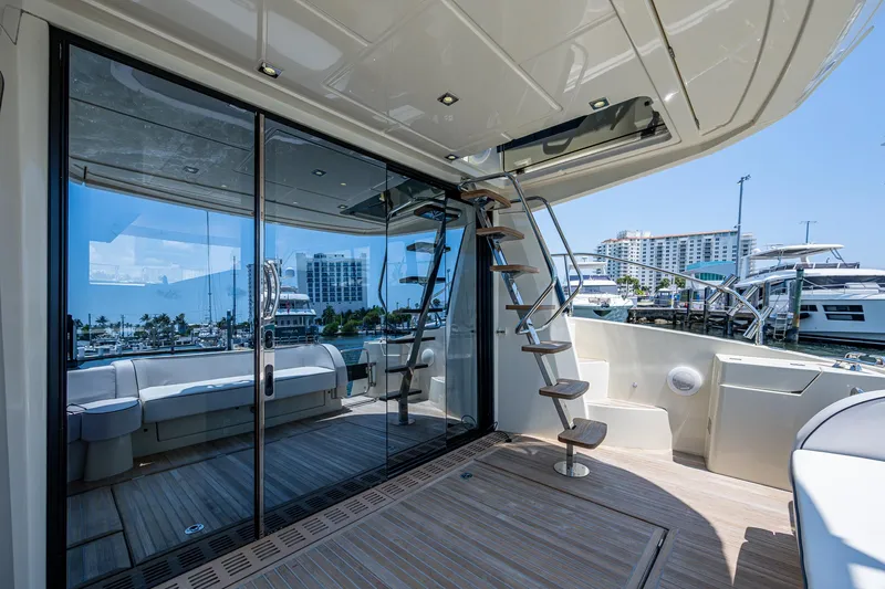 Slide: The Image of Luxurious 2015 Beneteau Monte Carlo yacht deck with modern design and marina view. - 17