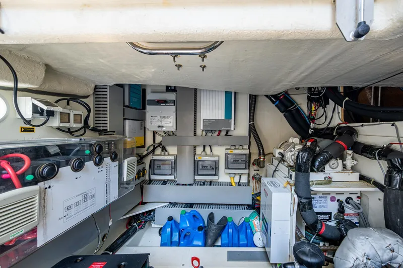 Slide: The Image of Engine room of 2015 Beneteau MONTE CARLO yacht, showcasing electrical systems and components. - 24