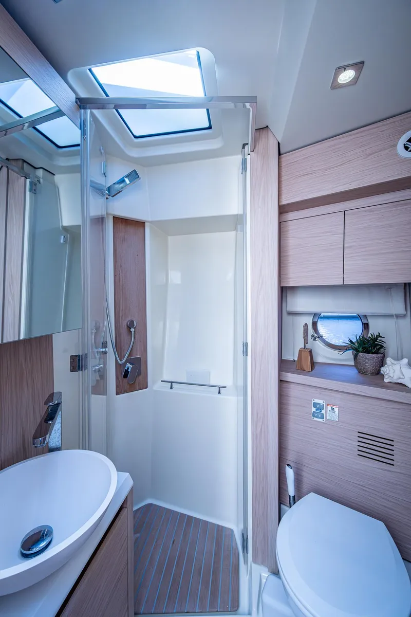 Slide: The Image of Luxurious bathroom in 2015 Beneteau Monte Carlo yacht with modern fixtures and skylight. - 32