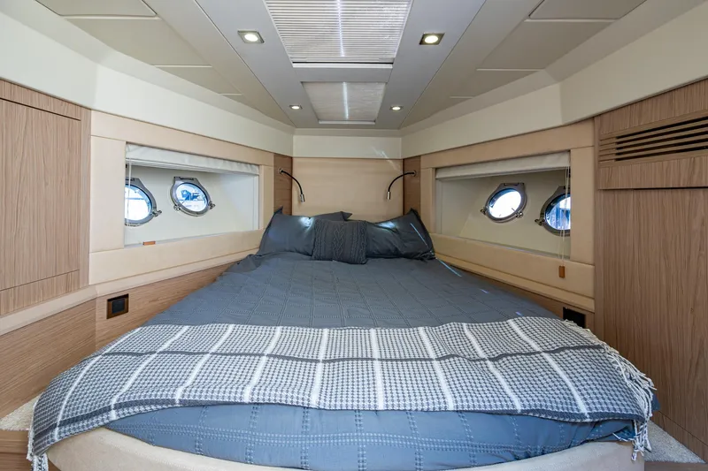 Slide: The Image of Luxurious cabin interior of 2015 Beneteau Monte Carlo yacht with cozy bed and porthole windows. - 35