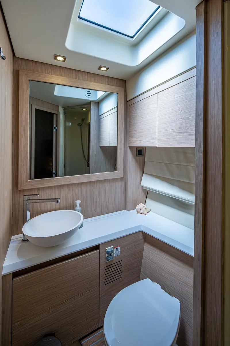 Slide: The Image of Luxurious bathroom in 2015 Beneteau Monte Carlo yacht with modern fixtures and skylight. - 38