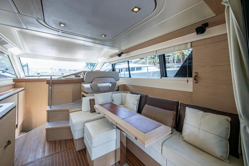 Slide: The Image of Luxurious interior of 2015 Beneteau Monte Carlo yacht with modern seating and wood finishes. - 45