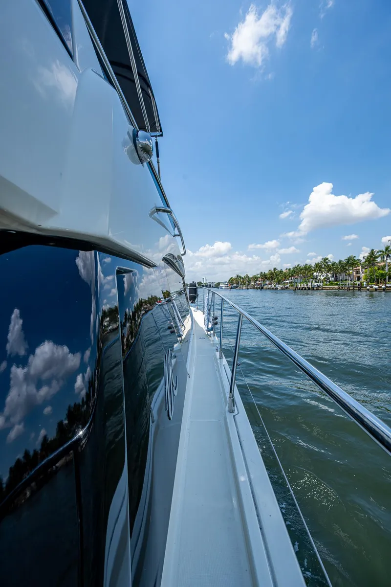 Slide: The Image of 2015 Beneteau Monte Carlo yacht cruising on a sunny day, reflecting blue sky and clouds. - 7