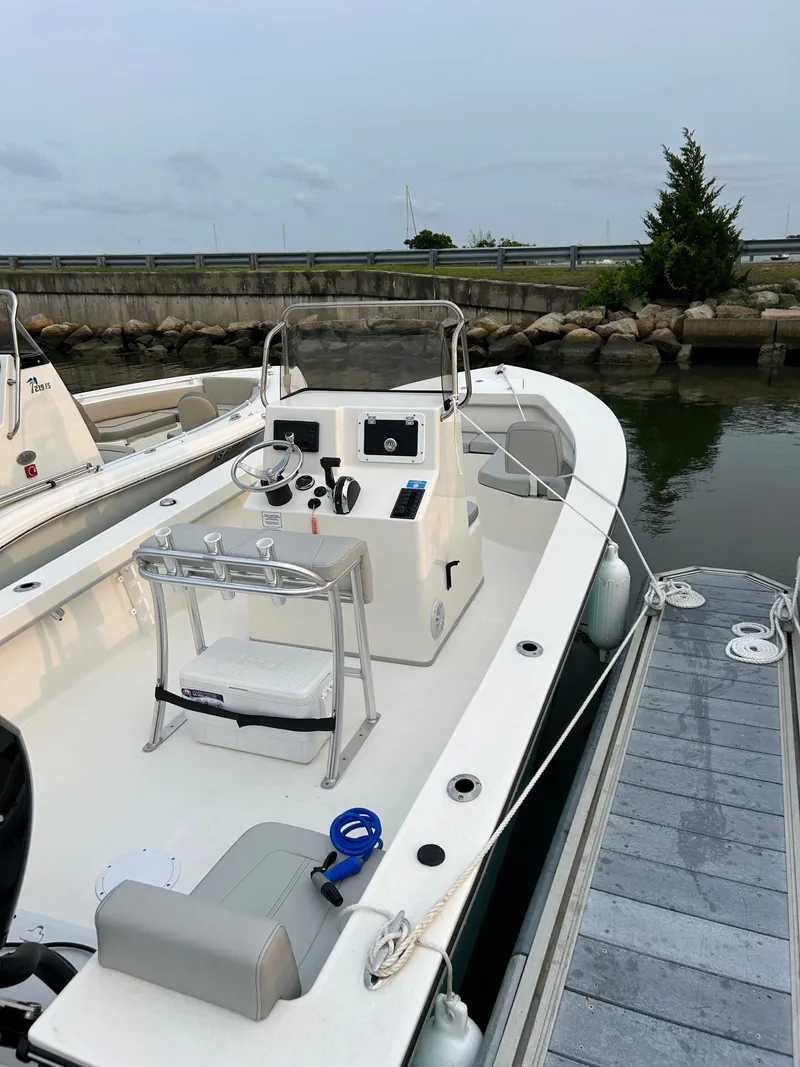 Slide: The Image of 2023 May-Craft 208 CC boat docked at marina. - 2