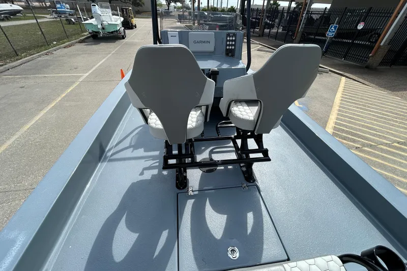 Slide: The Image of 2026 Skuta 24 Vista boat interior with dual seats and Garmin navigation system. - 10