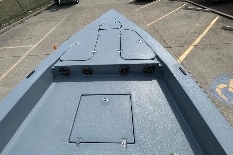 Slide: The Image of 2026 Skuta 24 Vista boat deck with storage compartments and speakers. - 15