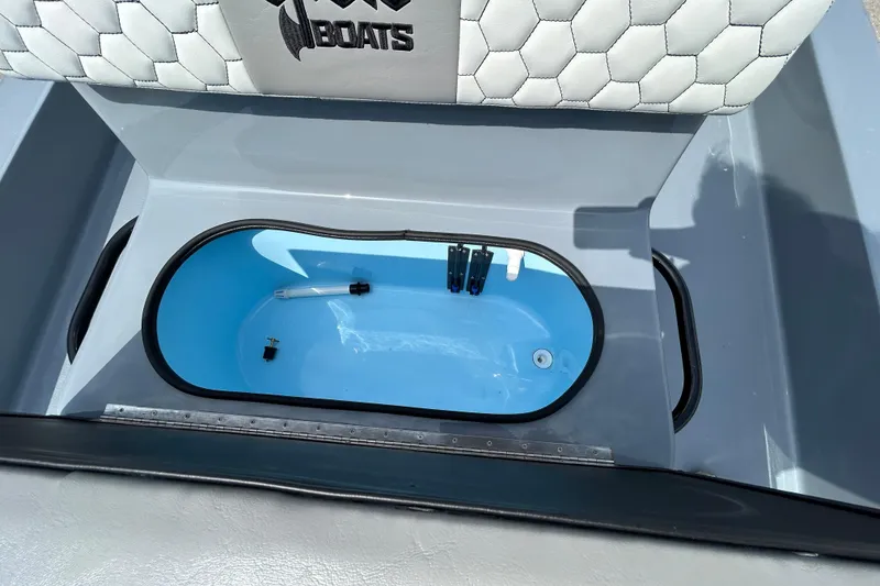 Slide: The Image of Livewell compartment in 2026 Skuta 24 Vista boat with cushioned seating. - 18