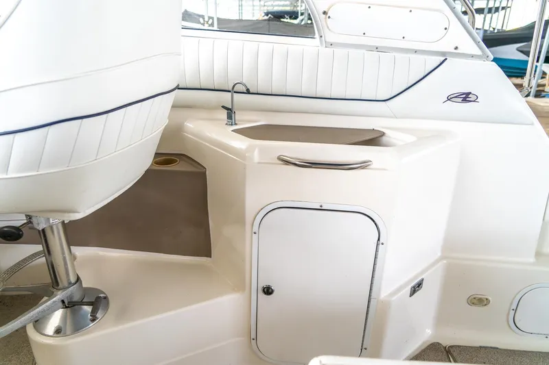 Slide: The Image of 1998 Bayliner 3255 Avanti boat interior with sink and seating area. - 9
