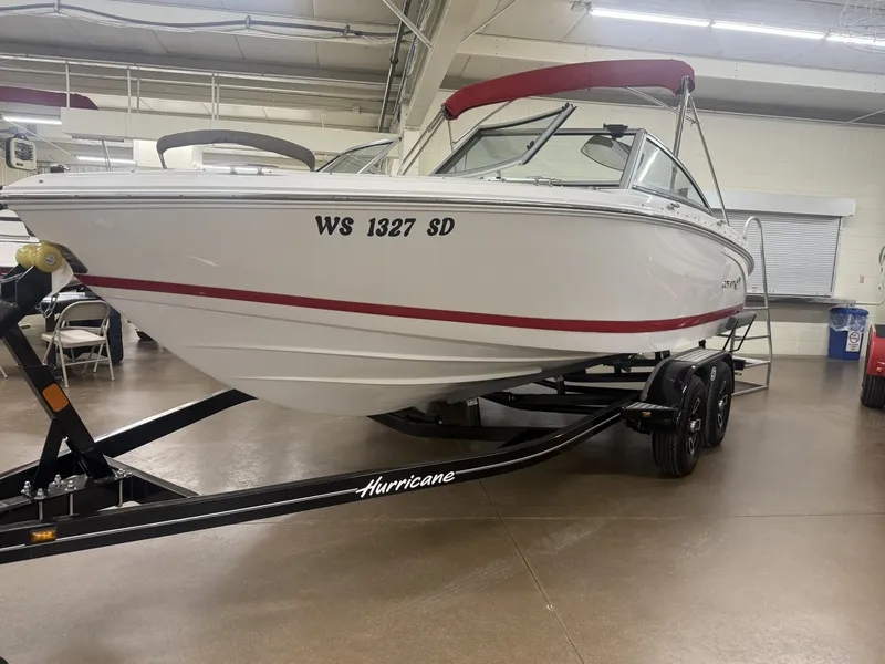 The Image of 2013 Cobalt 200 boat on a trailer in an indoor facility. - 0