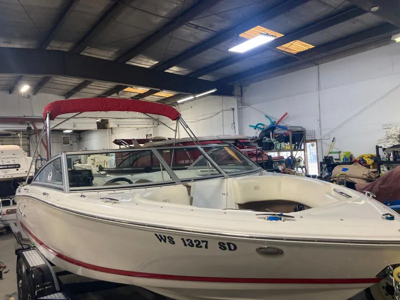 Slide: The Image of 2013 Cobalt 200 boat in a workshop. - 10