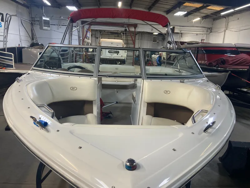 Slide: The Image of 2013 Cobalt 200 boat in a storage facility. - 11