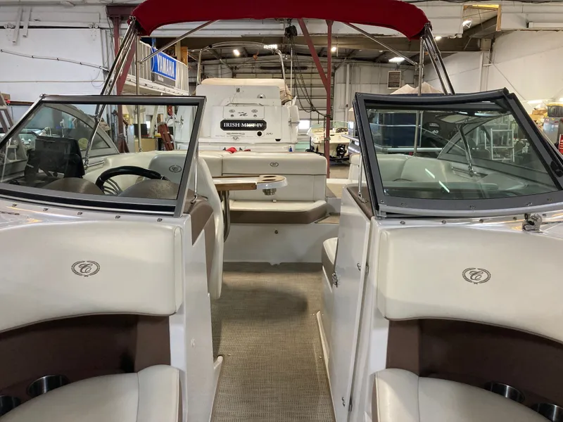 Slide: The Image of Interior view of a 2013 Cobalt 200 boat in a storage facility. - 13