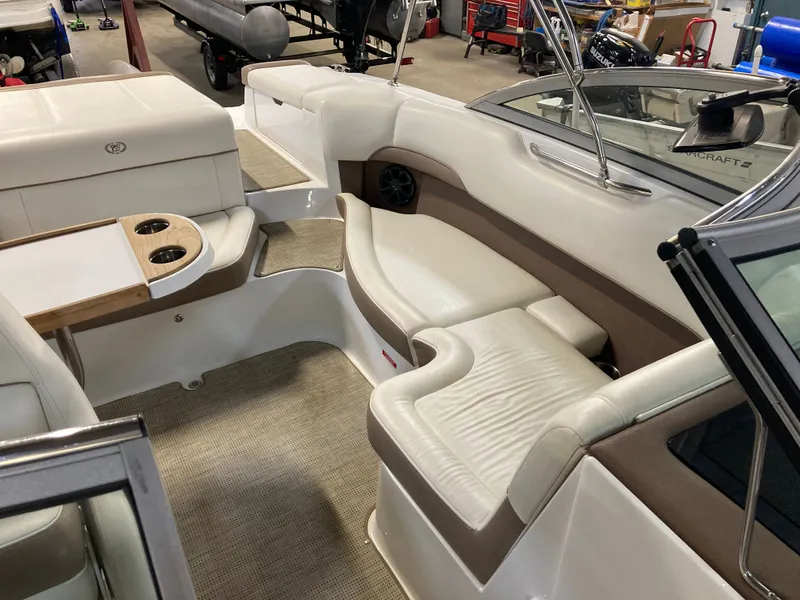 Slide: The Image of Interior of a 2013 Cobalt 200 boat with beige upholstery. - 15