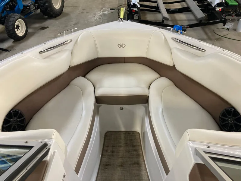 Slide: The Image of Interior of a 2013 Cobalt 200 boat with beige and white seating. - 24