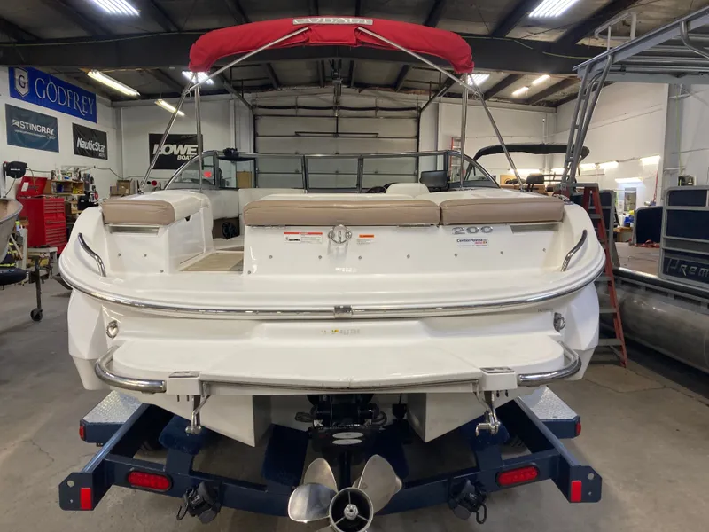 Slide: The Image of 2013 Cobalt 200 boat in a workshop setting. - 7