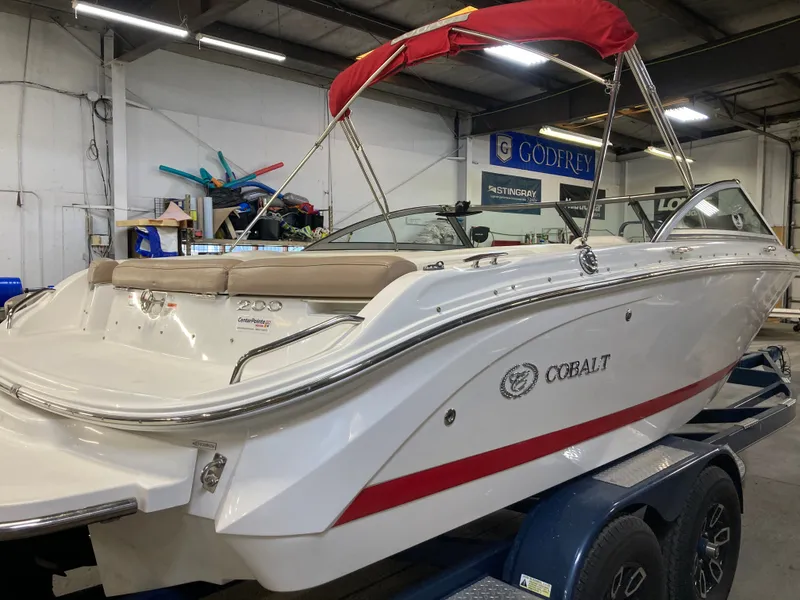 Slide: The Image of 2013 Cobalt 200 boat in a workshop on a trailer. - 8