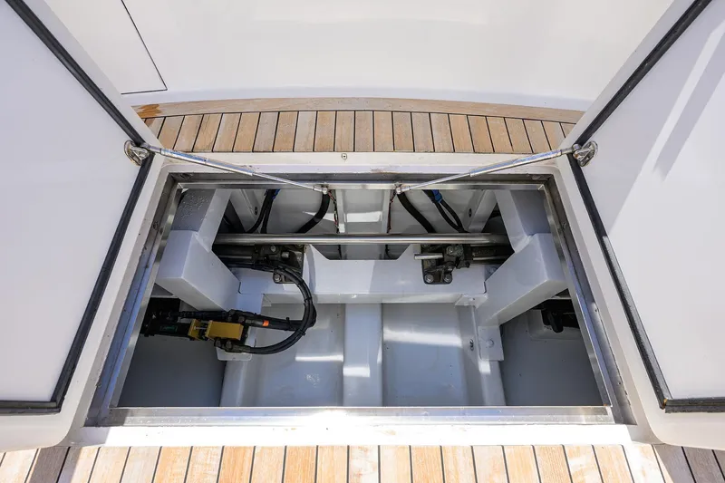 Slide: The Image of Open hatch of 2003 American Custom Yachts Sport Fisherman, revealing mechanical components. - 12