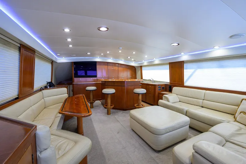 Slide: The Image of Luxurious interior of a 2003 American Custom Yachts Sport Fisherman, featuring elegant seating and wood finishes. - 15