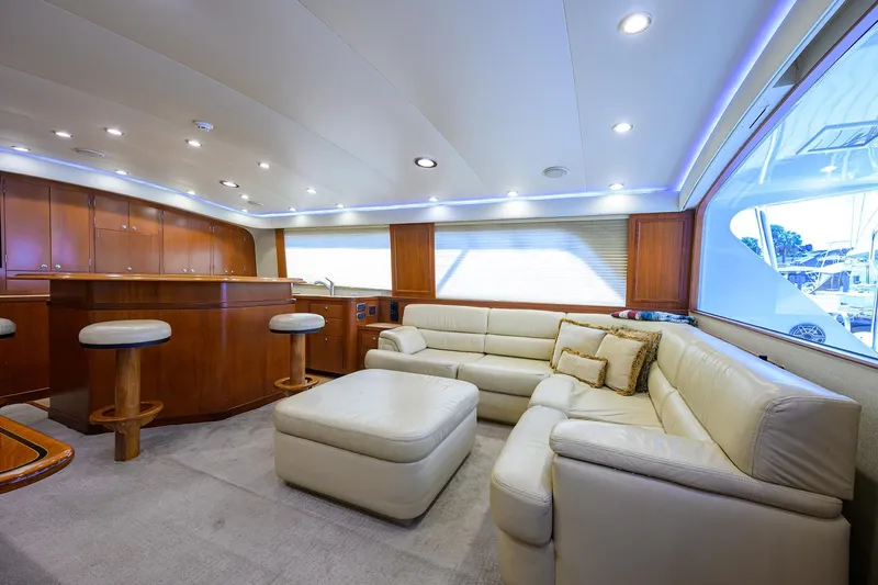 Slide: The Image of Luxurious interior of 2003 American Custom Yachts Sport Fisherman with leather seating and wooden accents. - 16