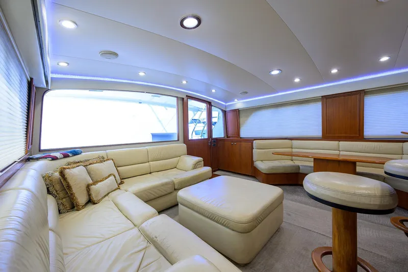 Slide: The Image of Luxurious interior of a 2003 American Custom Yachts Sport Fisherman, featuring plush seating and modern lighting. - 18