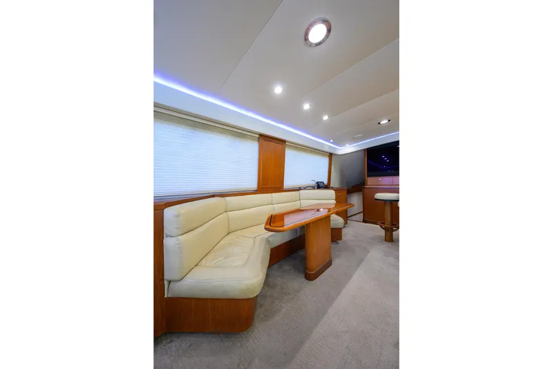 Slide: The Image of Luxurious interior of 2003 American Custom Yachts Sport Fisherman with plush seating and elegant lighting. - 21