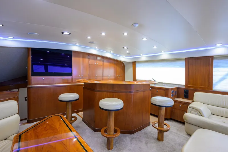 Slide: The Image of Luxurious interior of a 2003 American Custom Yachts Sport Fisherman with elegant wood finishes. - 23