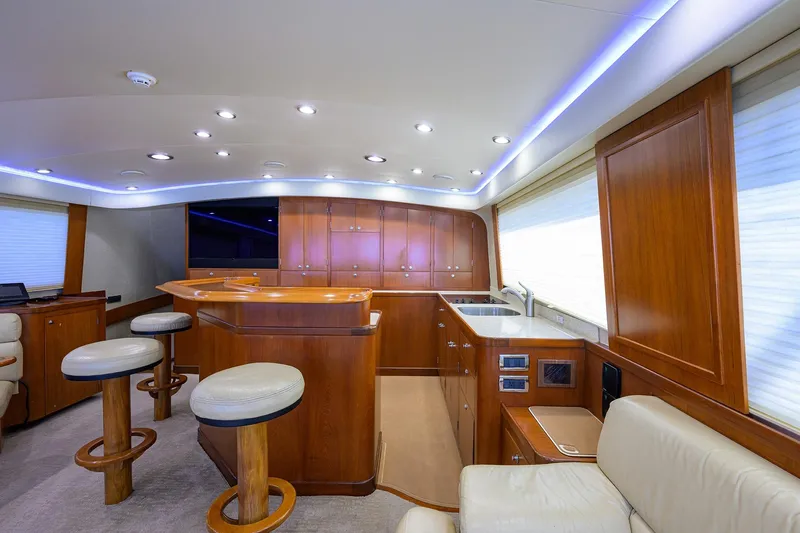 Slide: The Image of Luxurious interior of a 2003 American Custom Yachts Sport Fisherman, featuring elegant wood finishes. - 25
