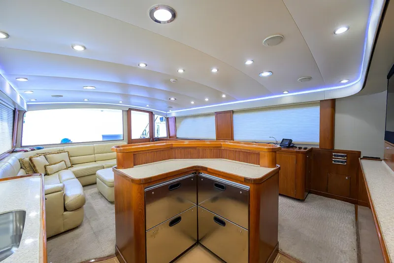 Slide: The Image of Luxurious interior of a 2003 American Custom Yachts Sport Fisherman, featuring elegant wood finishes. - 27