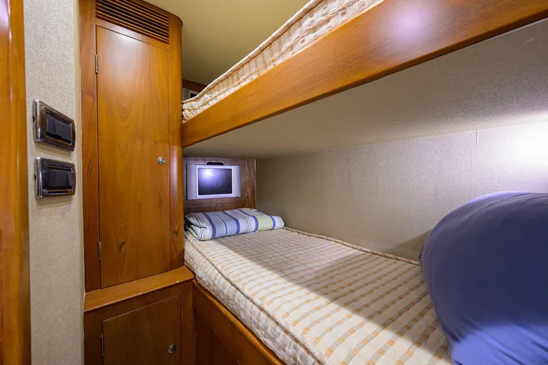 Slide: The Image of Cozy bunk bed cabin in 2003 American Custom Yachts Sport Fisherman. - 39