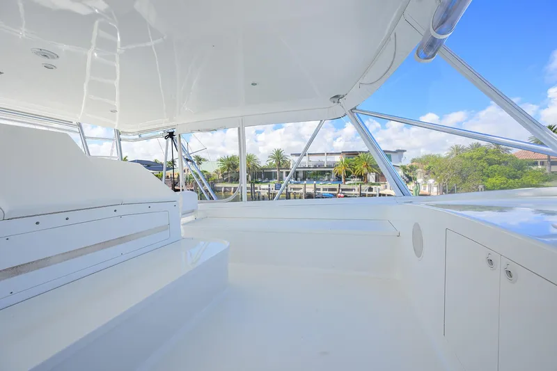 Slide: The Image of Spacious deck of 2003 American Custom Yachts Sport Fisherman, featuring sleek white design. - 48