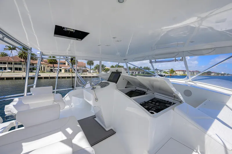 Slide: The Image of Luxurious 2003 American Custom Yachts Sport Fisherman helm with waterfront view. - 52