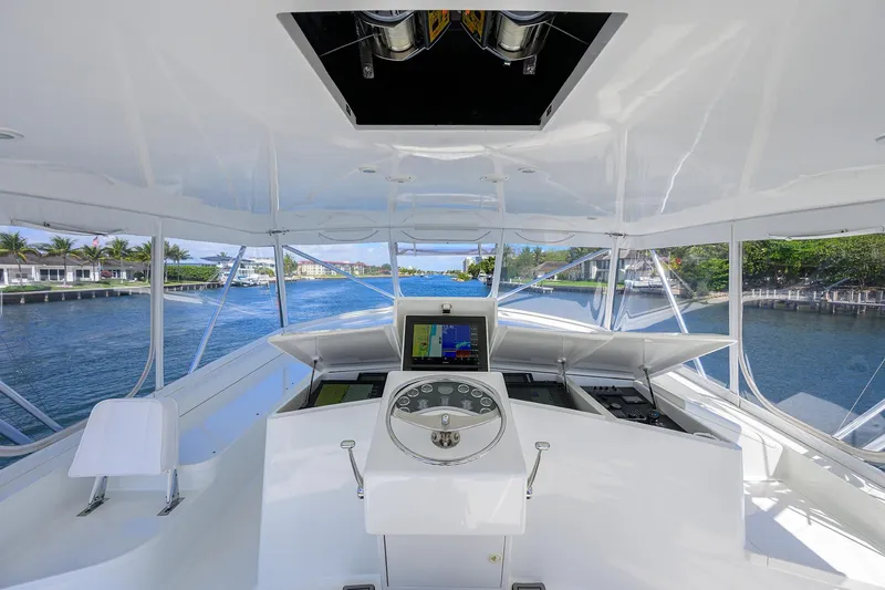 Slide: The Image of Helm of 2003 American Custom Yachts Sport Fisherman with scenic waterfront view. - 53