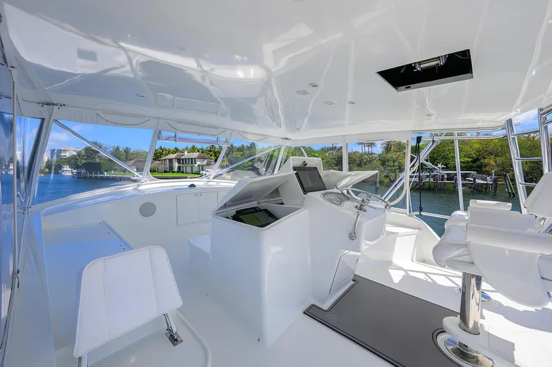 Slide: The Image of Luxurious 2003 American Custom Yachts Sport Fisherman interior with modern helm and scenic water views. - 54
