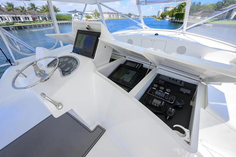 Slide: The Image of 2003 American Custom Yachts Sport Fisherman helm with navigation and communication equipment. - 56