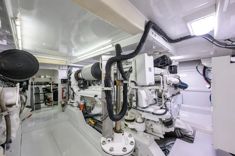 Slide: The Image of Engine room of 2003 American Custom Yachts Sport Fisherman, showcasing advanced machinery and equipment. - 62