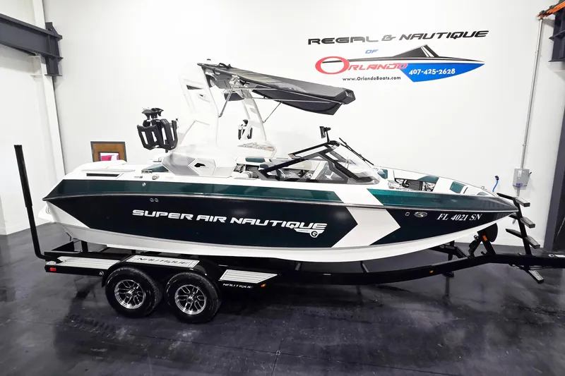 The Image of 2020 Nautique Super Air Nautique G21 boat on trailer in showroom. - 0