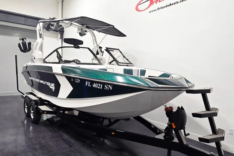 Slide: The Image of 2020 Nautique Super Air Nautique G21 boat on trailer in showroom. - 2