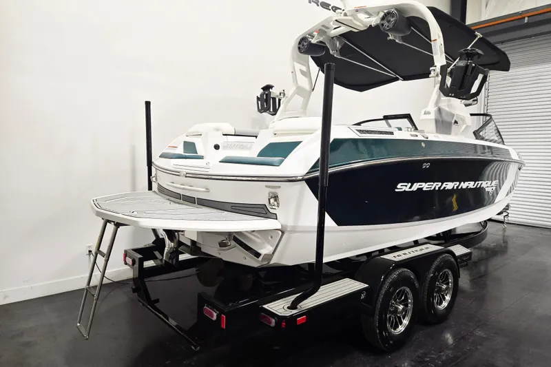 Slide: The Image of 2020 Nautique Super Air Nautique G21 boat on trailer in indoor setting. - 3