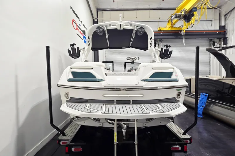 Slide: The Image of 2020 Nautique Super Air Nautique G21 boat in a showroom, rear view. - 4