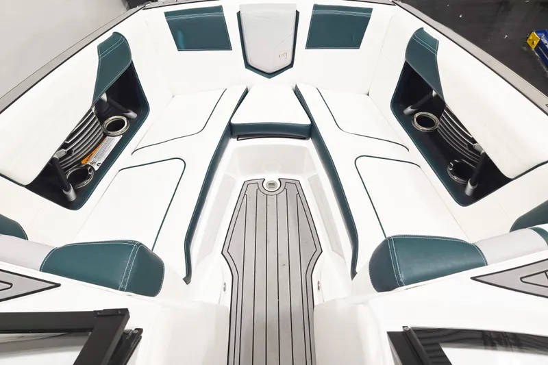 Slide: The Image of 2020 Nautique Super Air Nautique G21 boat interior with white and teal seating. - 6
