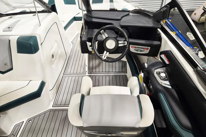 Slide: The Image of 2020 Nautique Super Air Nautique G21 boat interior with modern steering and seating. - 7