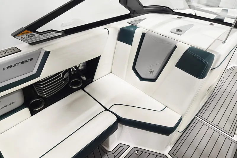 Slide: The Image of 2020 Nautique Super Air Nautique G21 interior with sleek white and gray seating. - 8